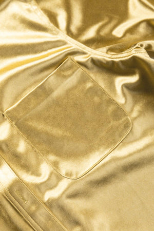 a close up of a gold jacket with a pocket