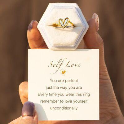 a person holding a card with a ring on it