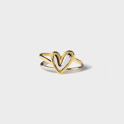 a gold ring with a heart on it