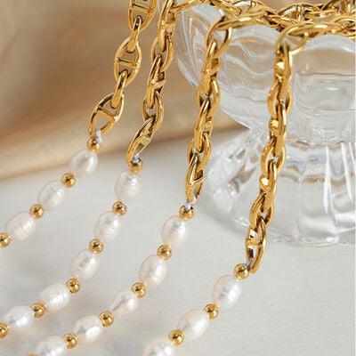 a close up of a necklace on a table