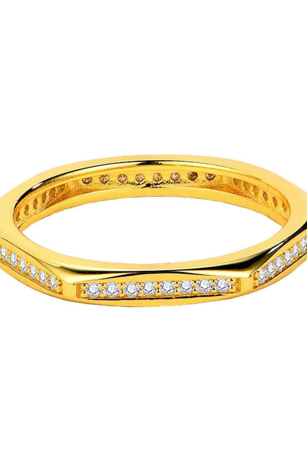 a yellow gold ring with white diamonds