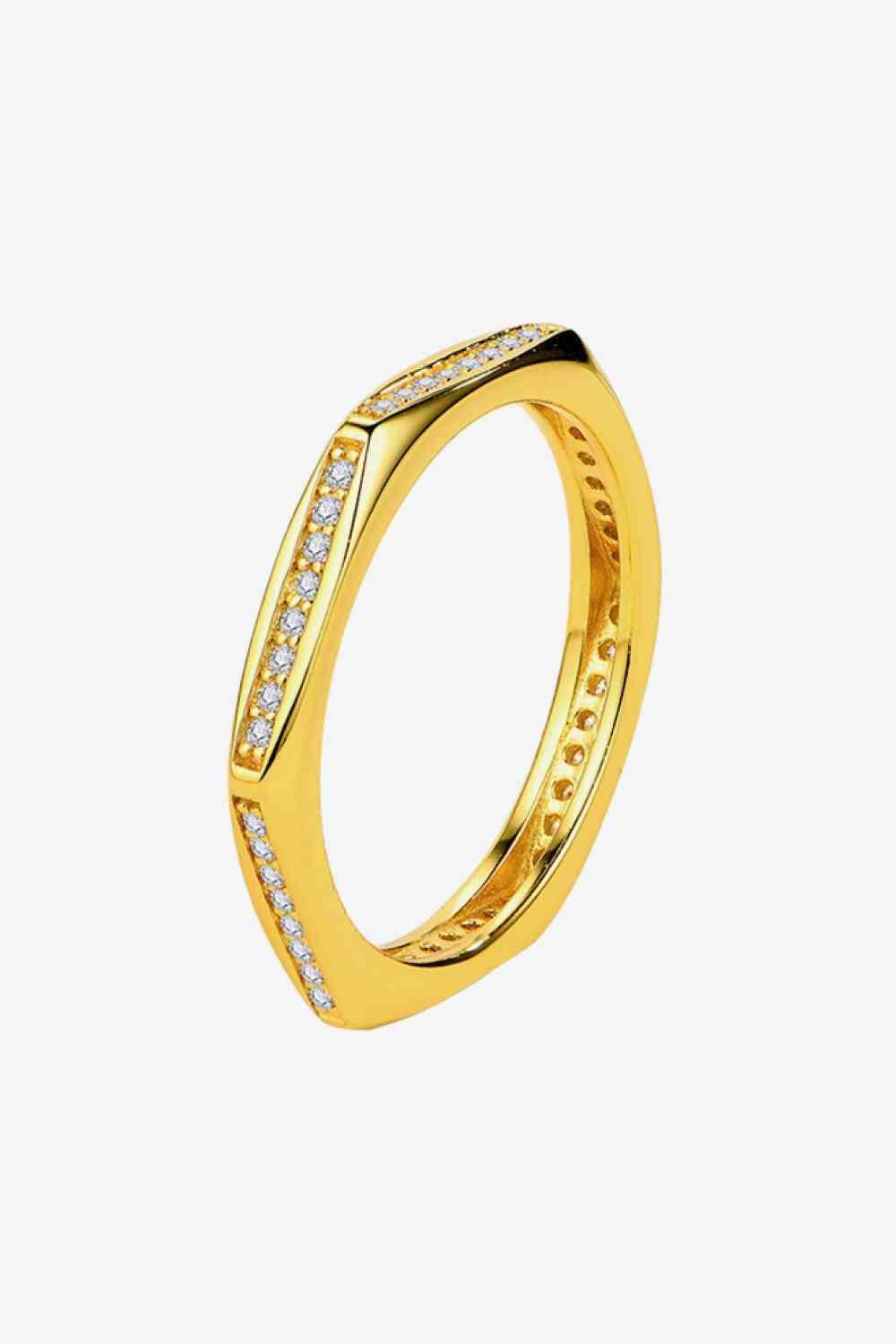 a yellow gold ring with diamonds