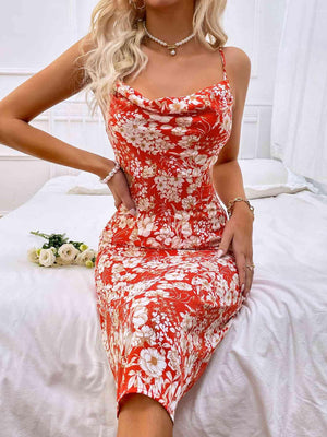 a woman sitting on a bed wearing a red and white dress