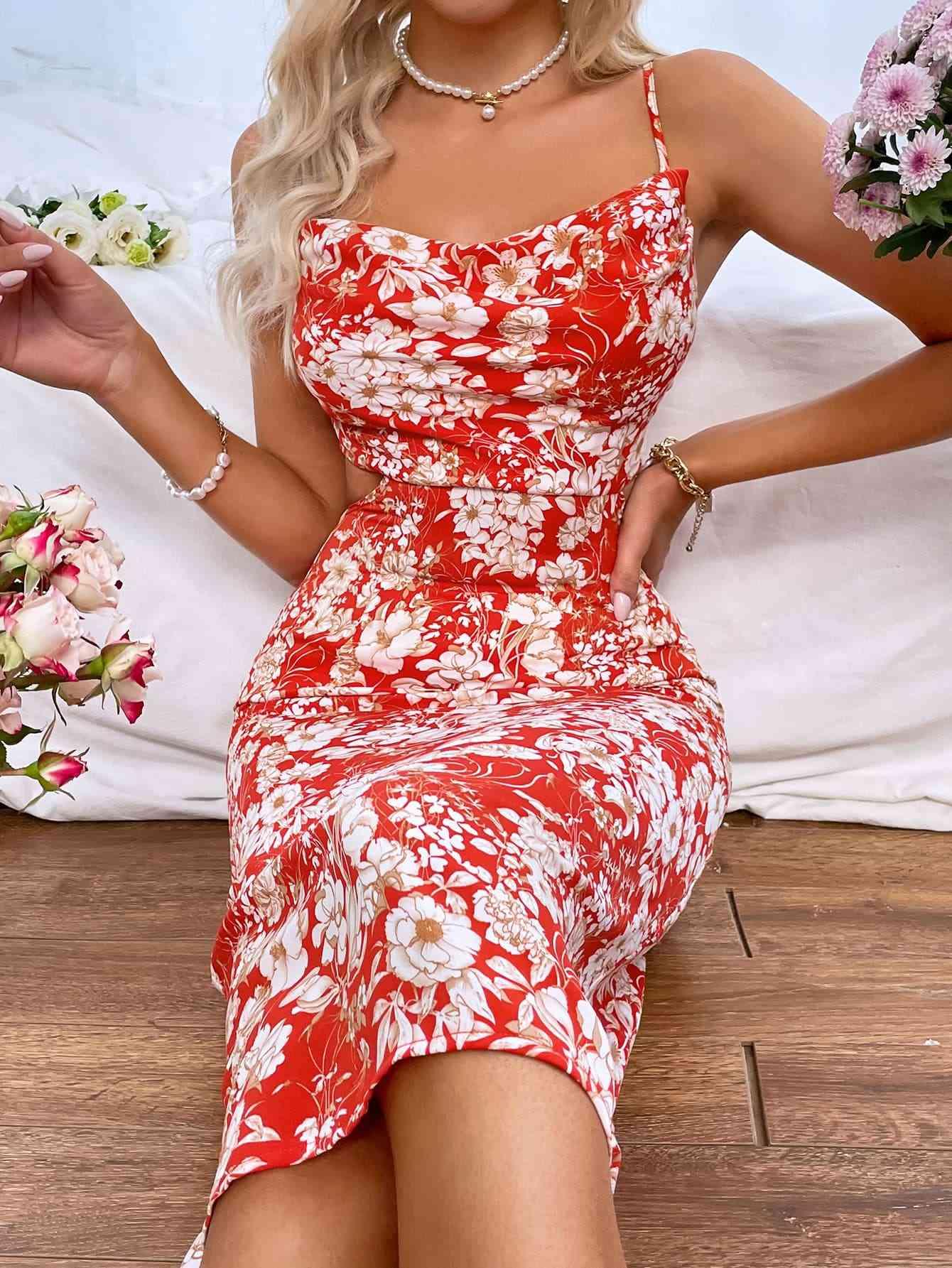 a woman in a red and white floral print dress