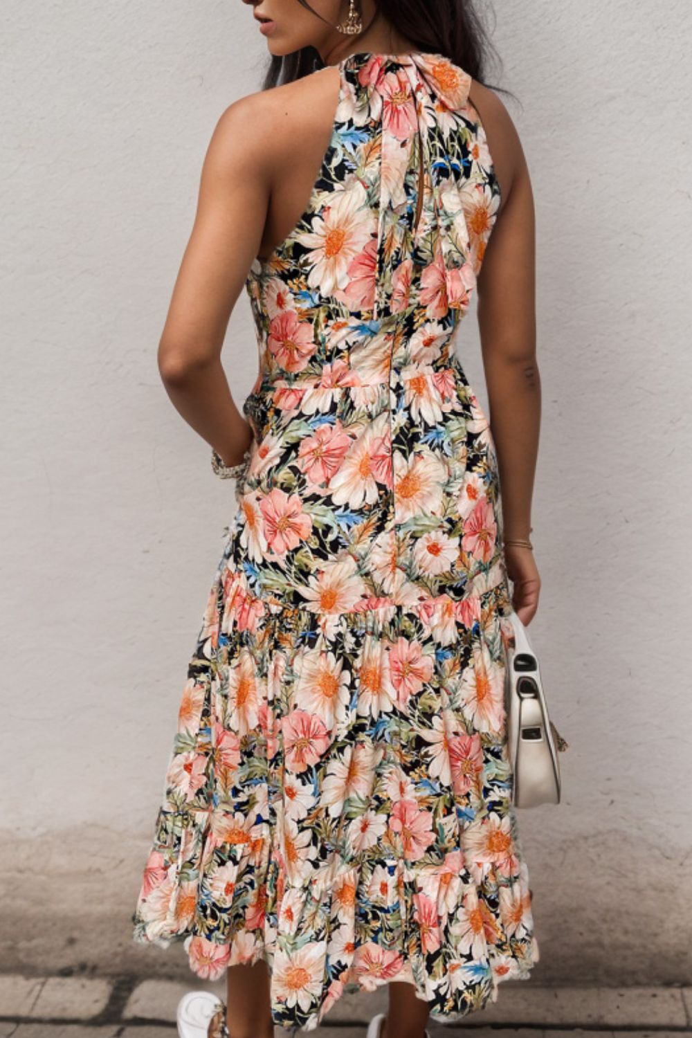 a woman in a floral print dress