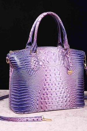 a purple purse sitting on top of a table