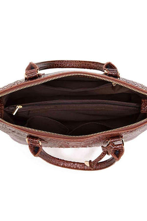 the inside of a brown purse on a white background