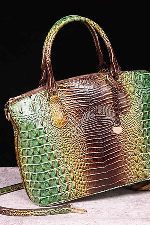 a green and brown purse sitting on top of a table