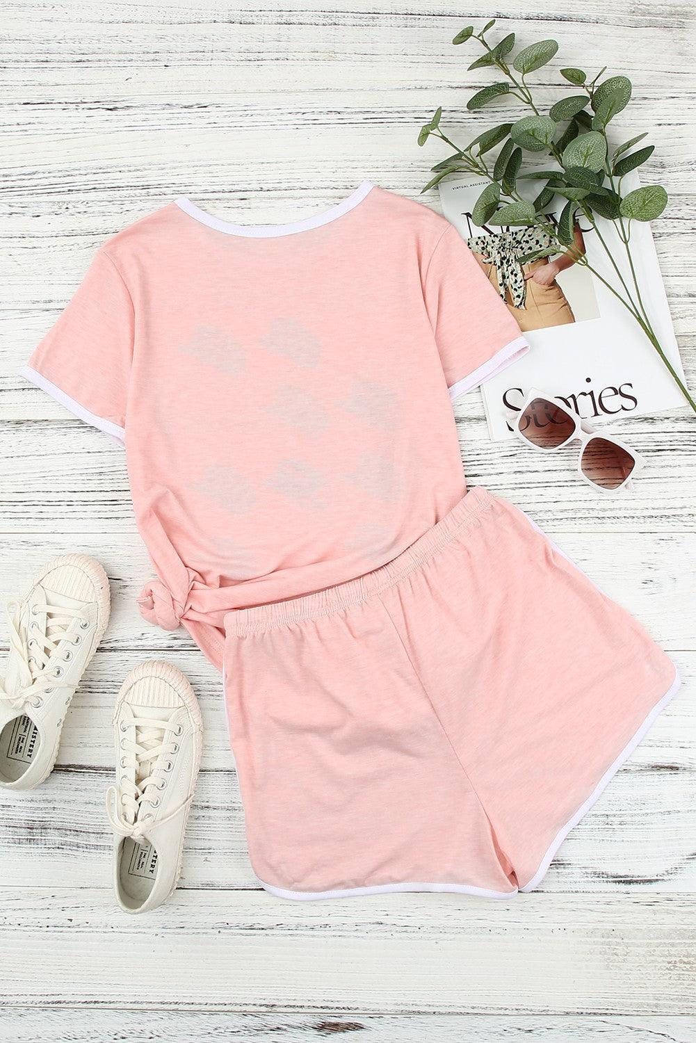 a pink shirt and shorts outfit with sunglasses