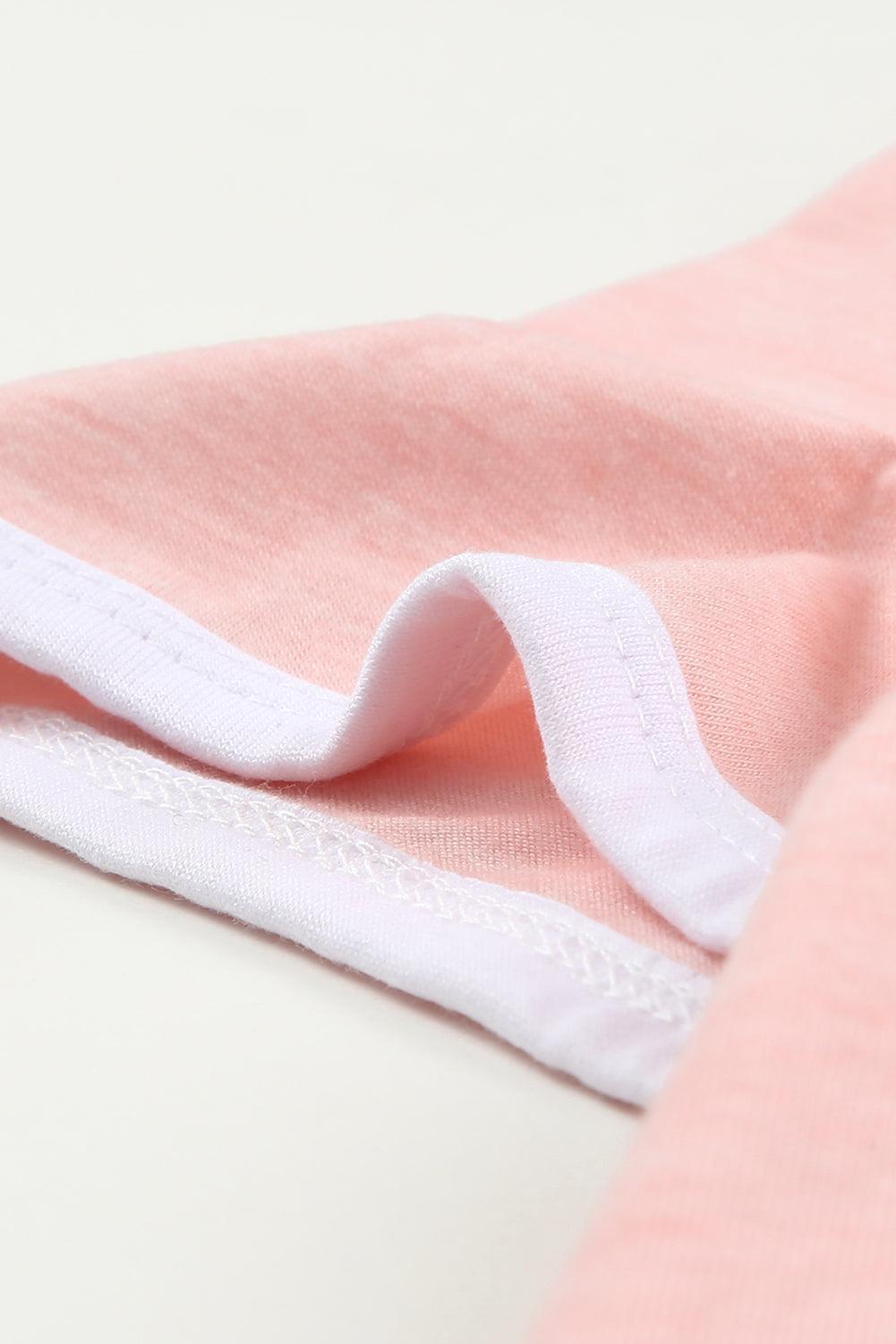 a close up of a pink and white shirt