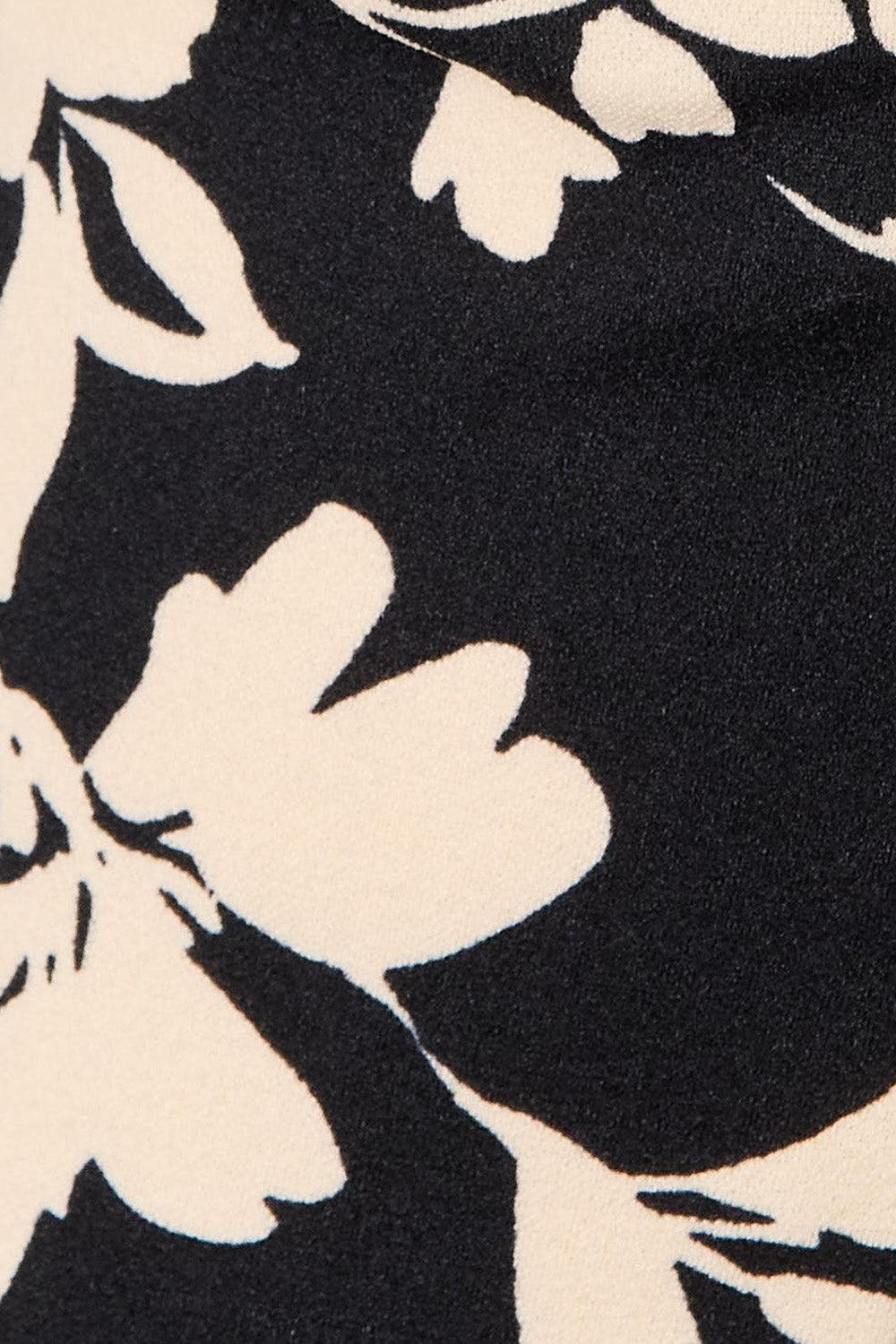 a close up of a black and white flowered shirt