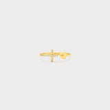 a gold ring with a cross on it