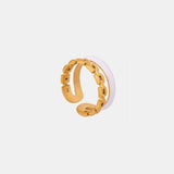 a gold ring on a white background