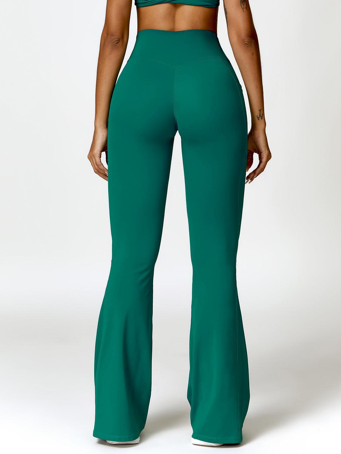 a woman in a green top and pants