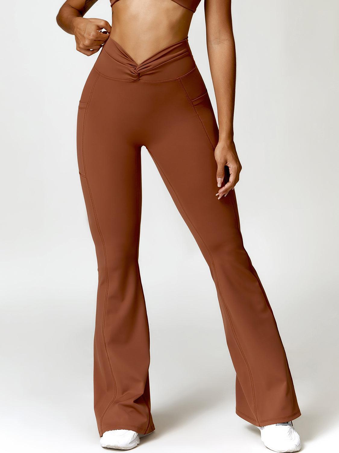 a woman in a brown sports bra top and brown pants