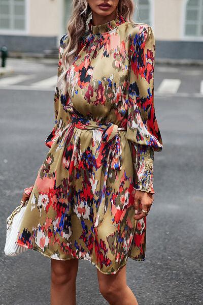 a woman in a floral print dress is walking down the street