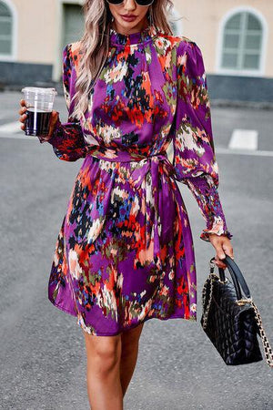 a woman walking down a street holding a cup of coffee