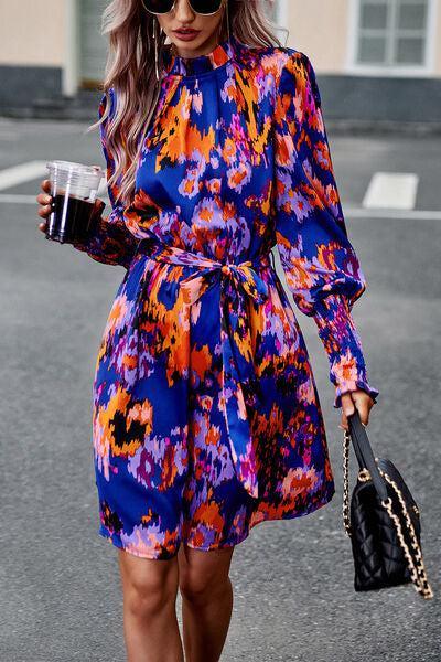 a woman walking down a street holding a cup of coffee