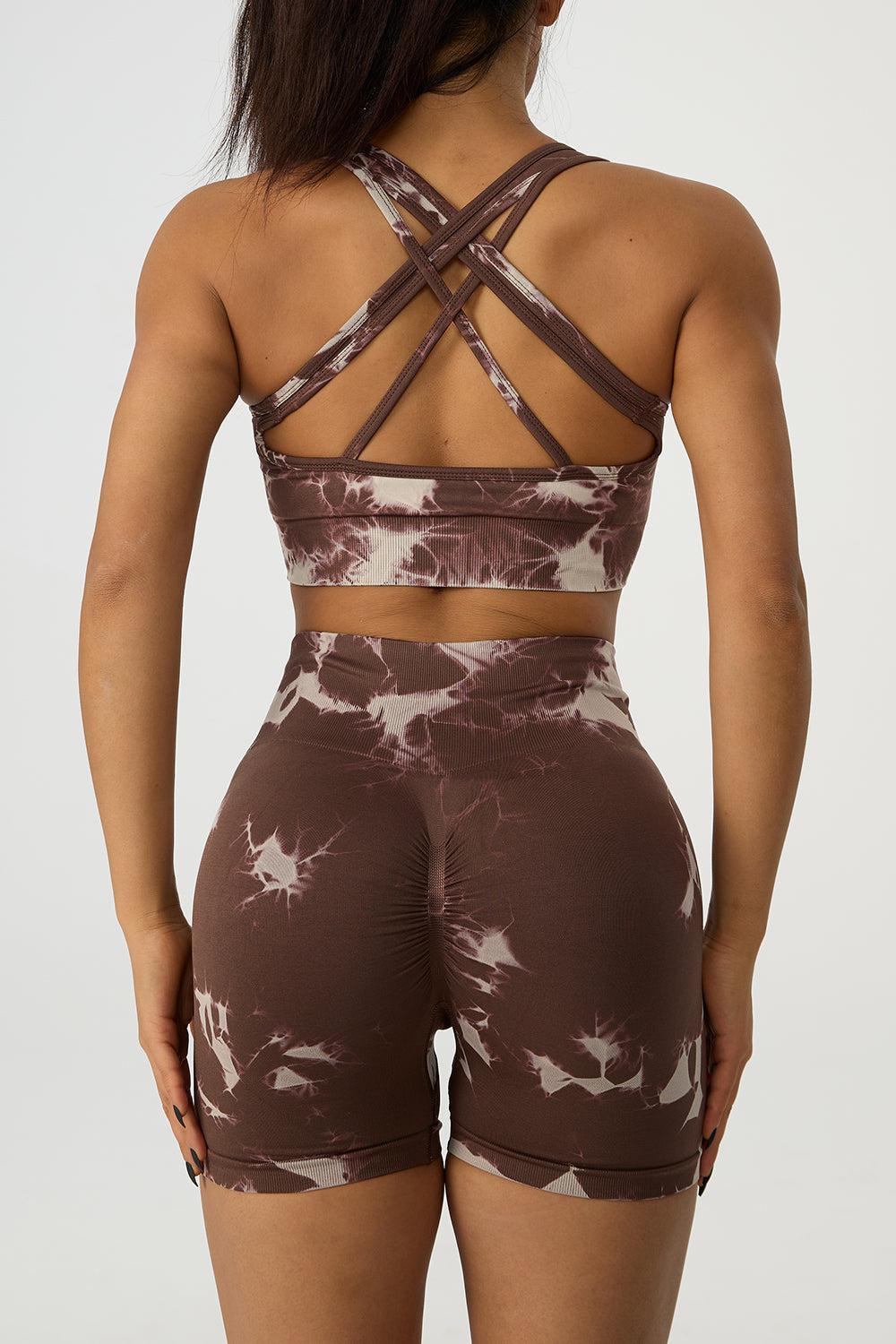 the back of a woman wearing a brown and white tie dye sports bra