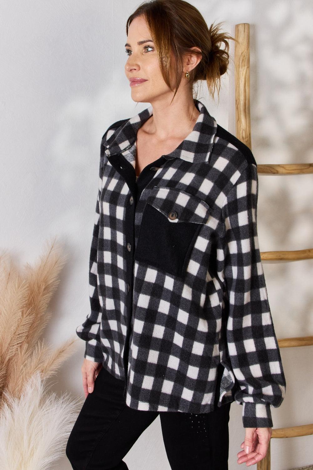 a woman wearing a black and white checkered shirt