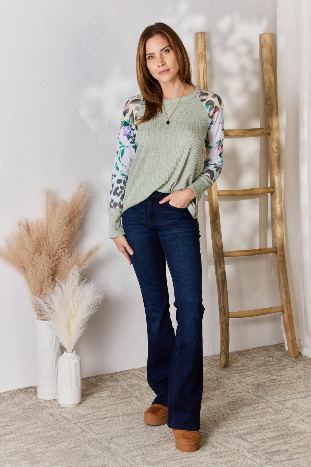 a woman standing in front of a ladder