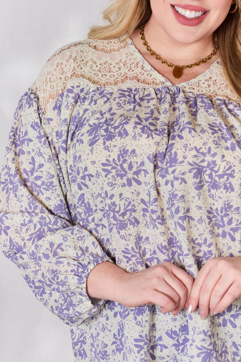 a woman wearing a purple and white top