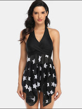 a woman in a black and white swimsuit with stars on it