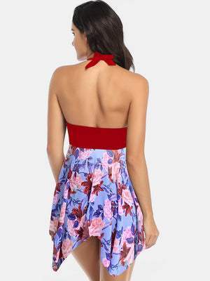 the back of a woman wearing a floral print dress