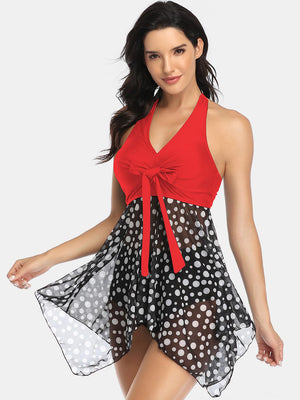 a woman in a red top and polka dot skirt