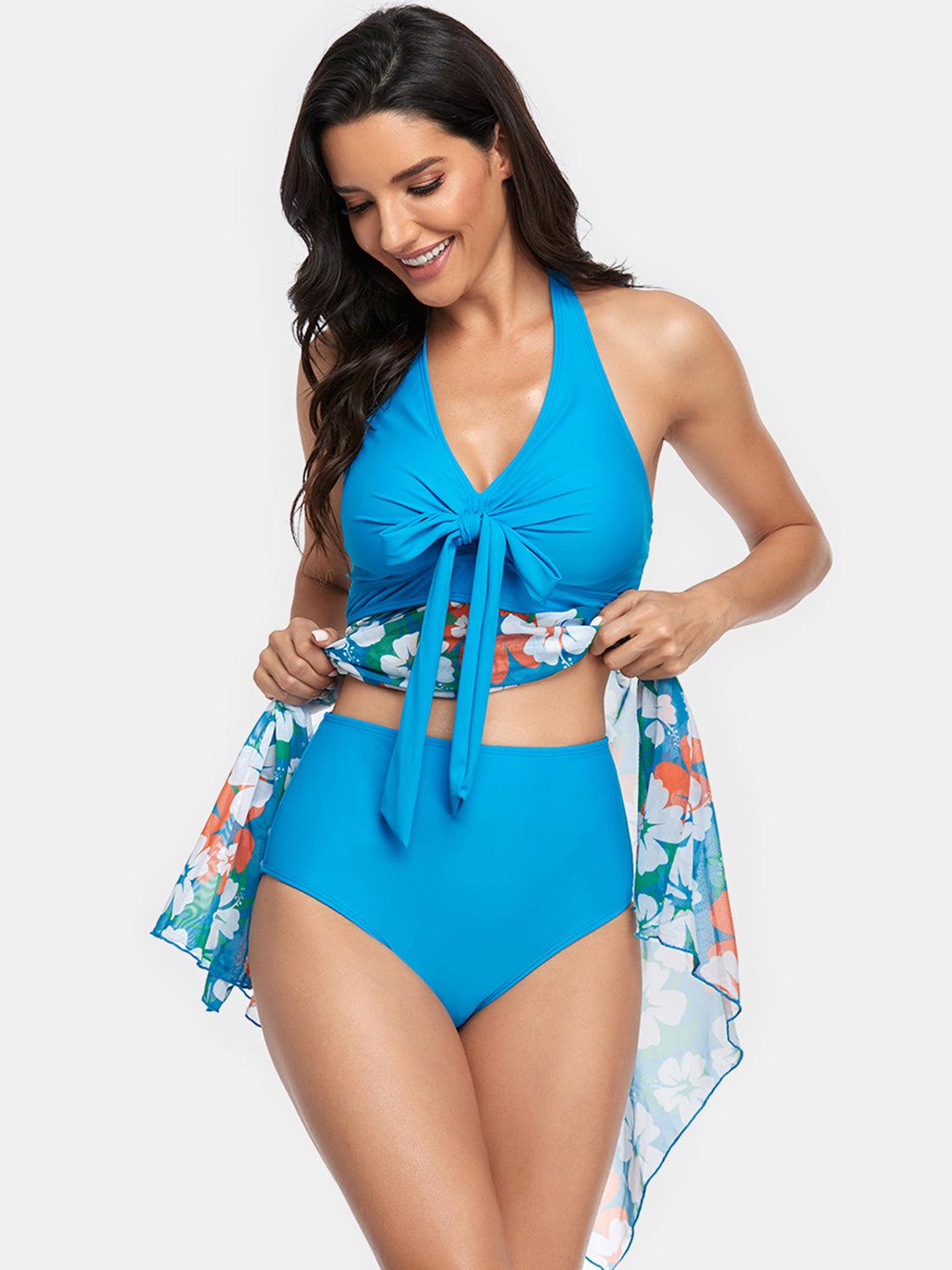 a woman in a blue swimsuit with a tie around her waist