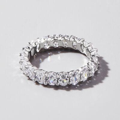 a diamond ring on a white surface