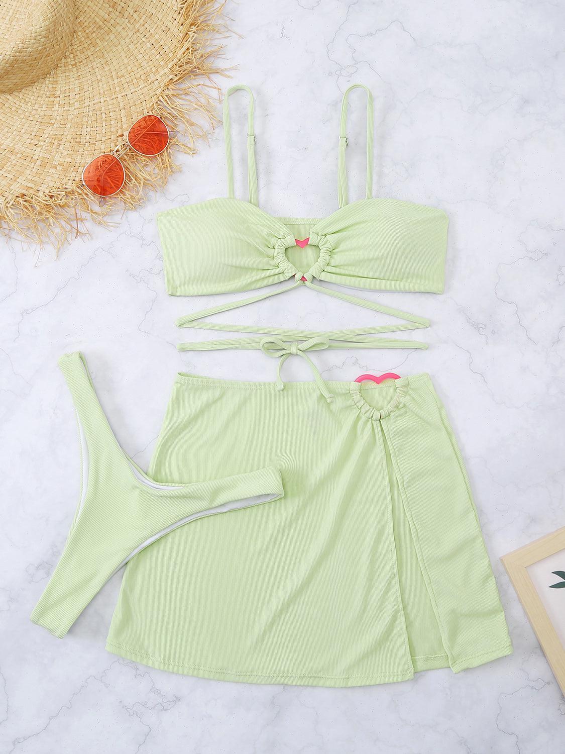 two pieces of green bikinisuit with a straw hat