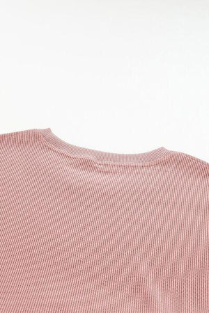 a close up of a pink shirt on a white background