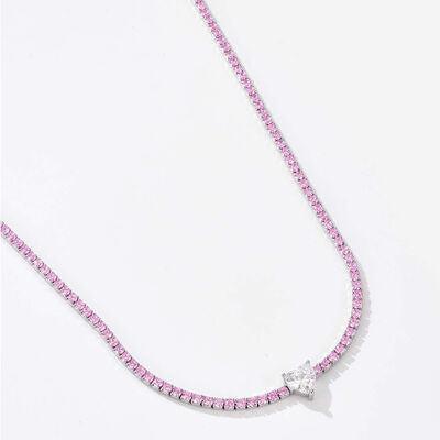 a pink beaded necklace with a cross on it