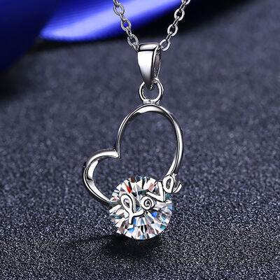 a heart shaped necklace with a crystal stone
