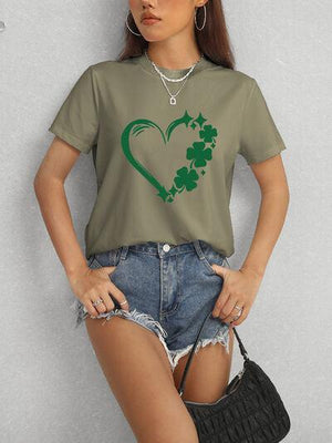 a woman wearing a t - shirt with a shamrock heart on it