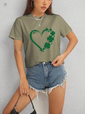 a woman wearing a t - shirt with a shamrock heart on it