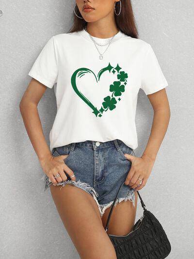 a woman wearing a white t - shirt with a shamrock heart on it