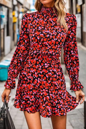 a woman in a red and black dress