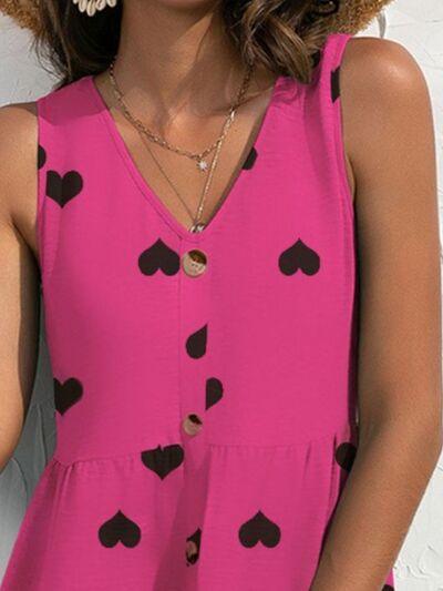 a woman wearing a pink top with hearts on it