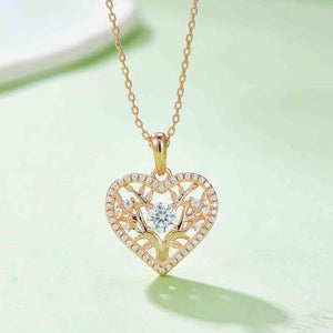 a heart shaped pendant with a diamond center