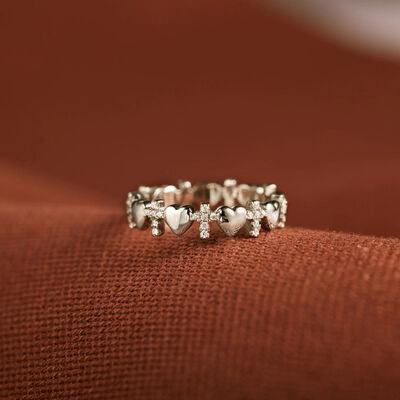 a couple of rings sitting on top of a red cloth