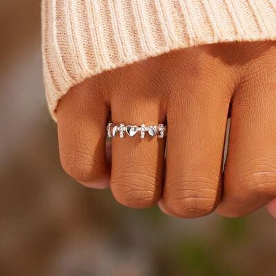 a woman's hand with a diamond ring on it