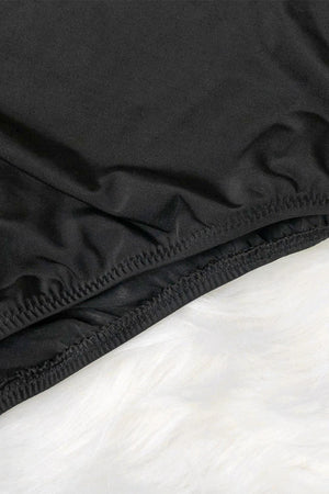 a close up of a black jacket with white fur