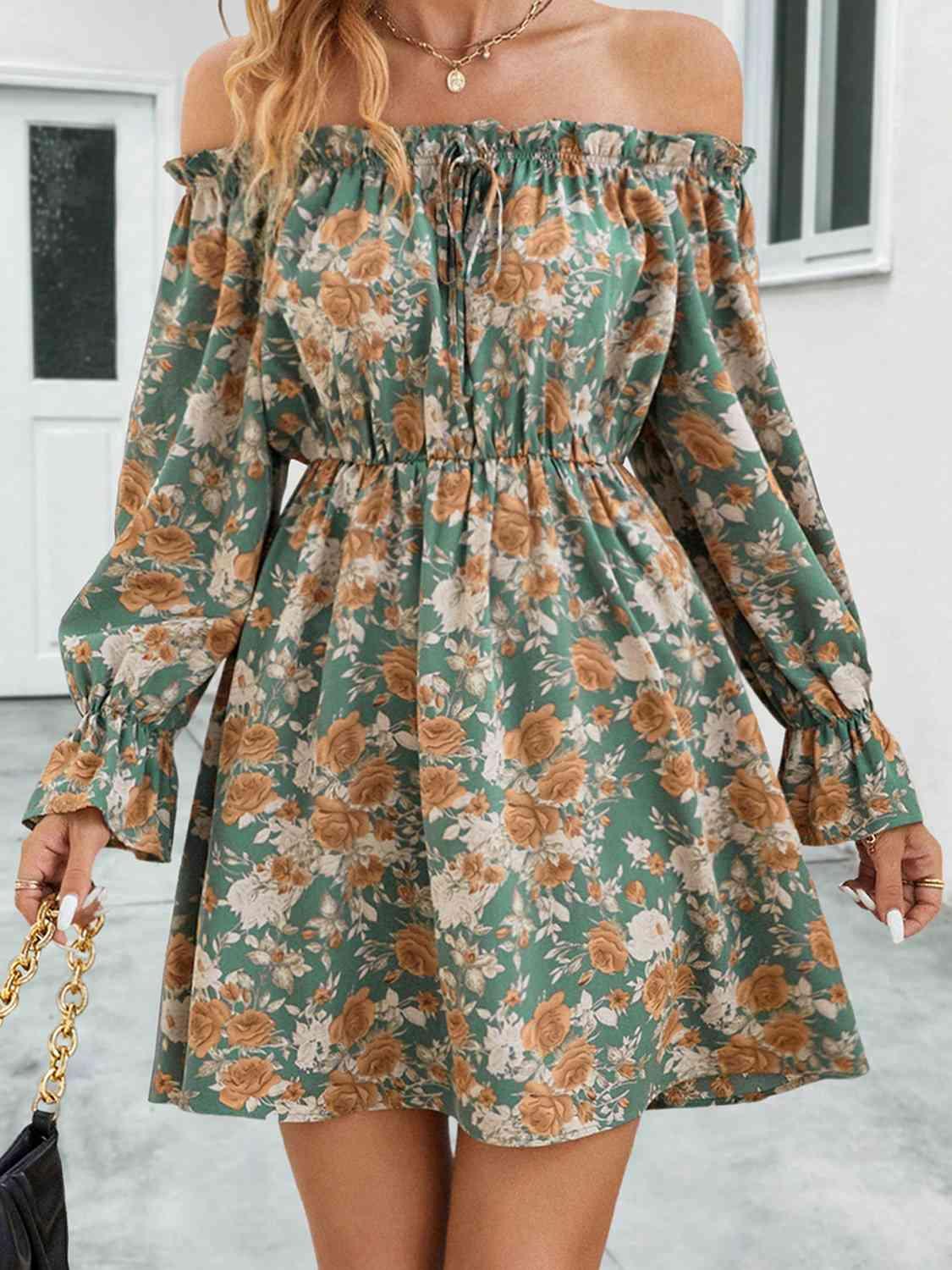 a woman wearing a floral print dress