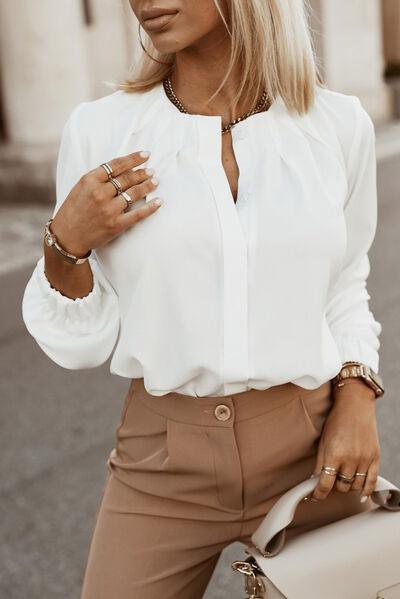 a woman wearing a white shirt and tan pants