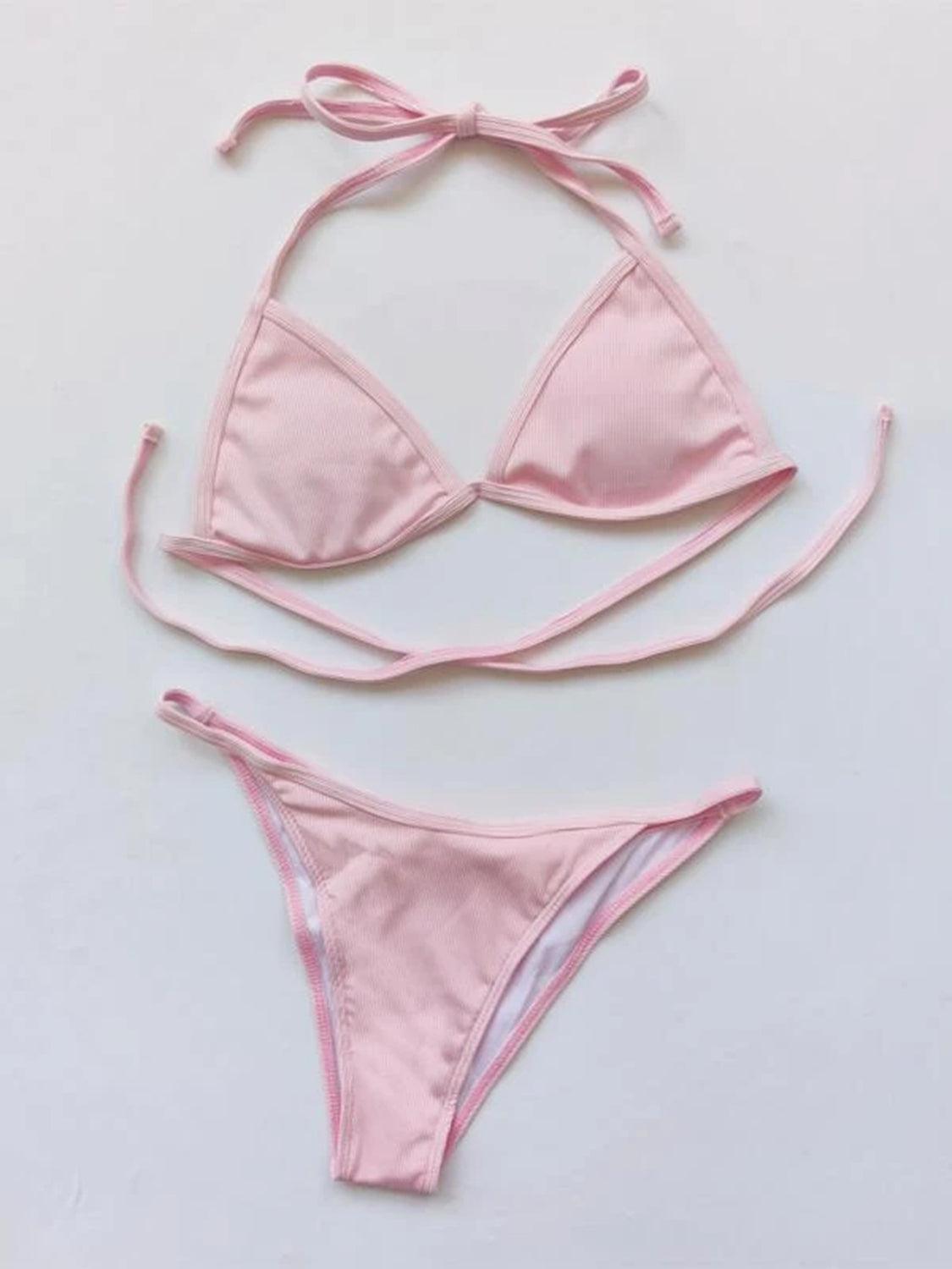 a pink bikini top with a tie around it