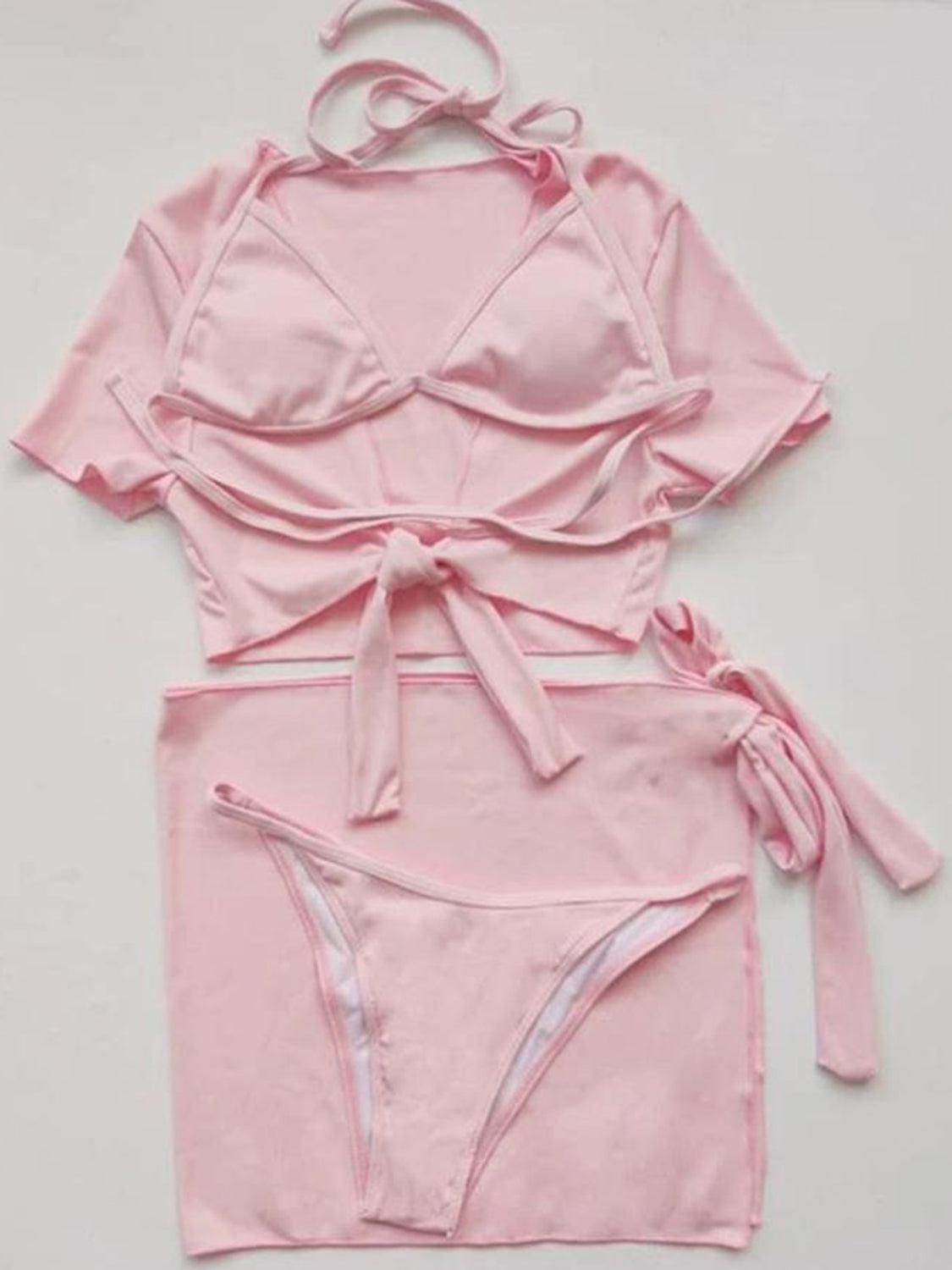 a pink bikinisuit with a tie around the waist