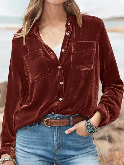 a woman wearing a red shirt and jeans