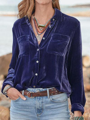 a woman wearing a blue shirt and jeans